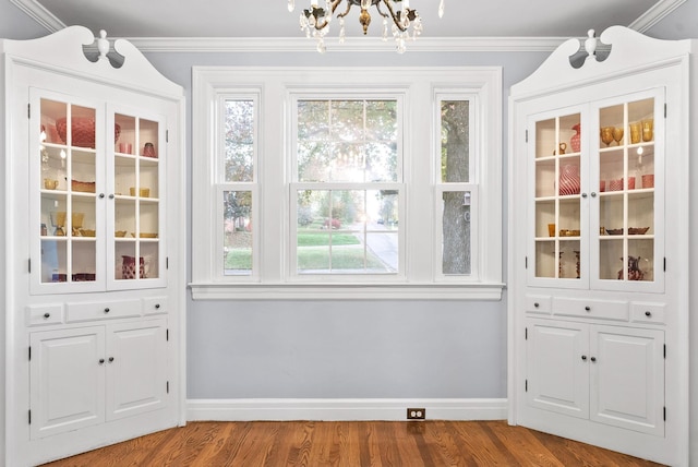 unfurnished sunroom with plenty of natural light and an inviting chandelier