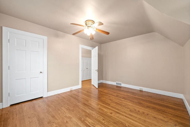 bonus room featuring ceiling fan, light hardwood / wood-style floors, and vaulted ceiling