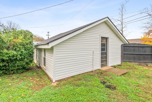 view of outbuilding featuring a yard