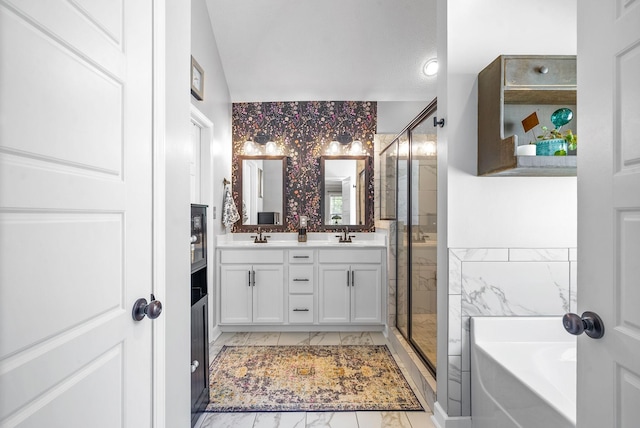 bathroom with plus walk in shower, vanity, and tile walls