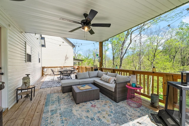 deck featuring ceiling fan and an outdoor hangout area