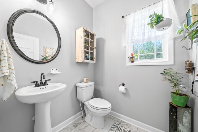 bathroom featuring sink and toilet