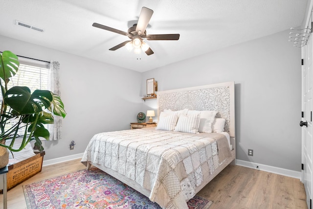 bedroom featuring ceiling fan and wood-type flooring