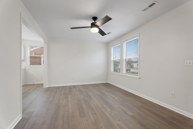 spare room featuring ceiling fan and wood-type flooring