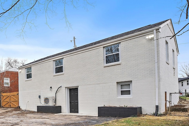 rear view of house featuring ac unit