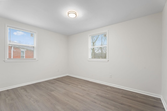 spare room with hardwood / wood-style flooring