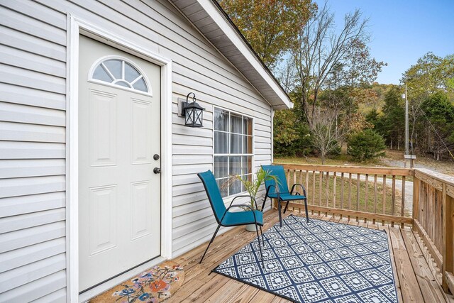 entrance to property with a deck