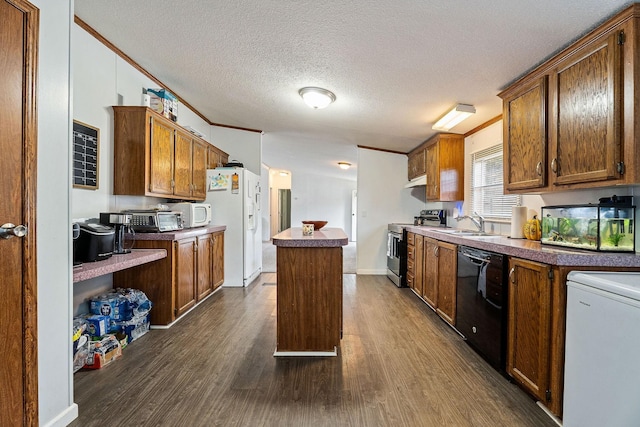 kitchen featuring white appliances, a kitchen island, dark wood-type flooring, crown molding, and a textured ceiling