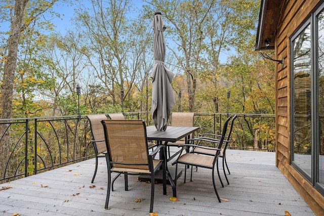 wooden deck with outdoor dining space