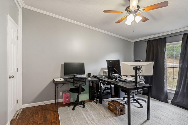 office featuring ornamental molding, ceiling fan, baseboards, and wood finished floors