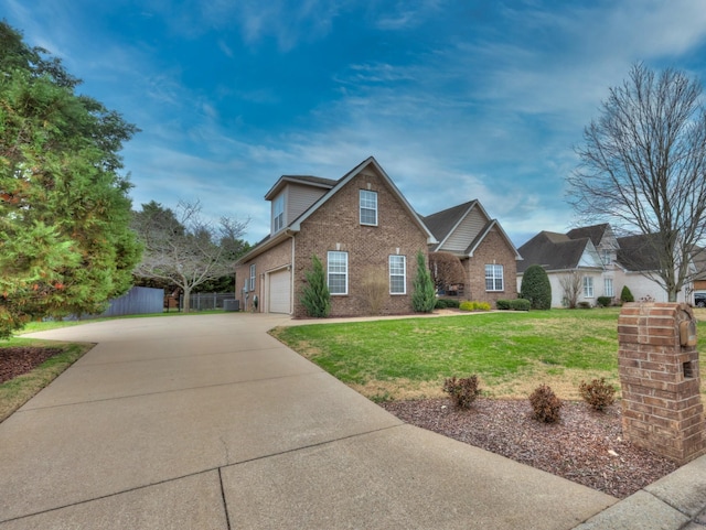 view of front of property with a front yard and a garage