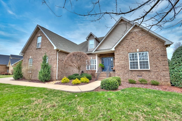 view of front of home with a front lawn