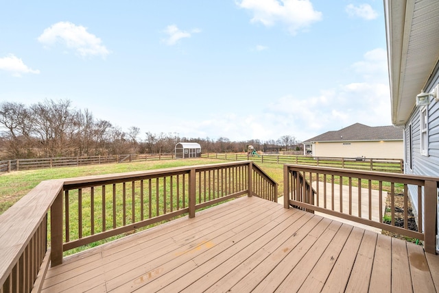 wooden terrace featuring a yard