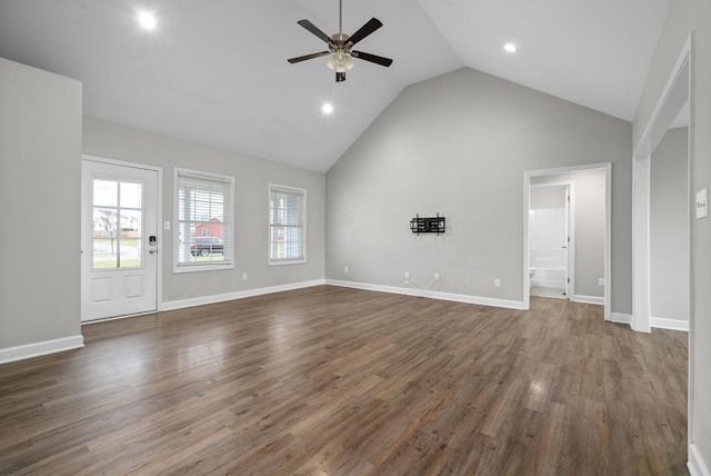 unfurnished living room featuring dark hardwood / wood-style flooring, ceiling fan, and lofted ceiling