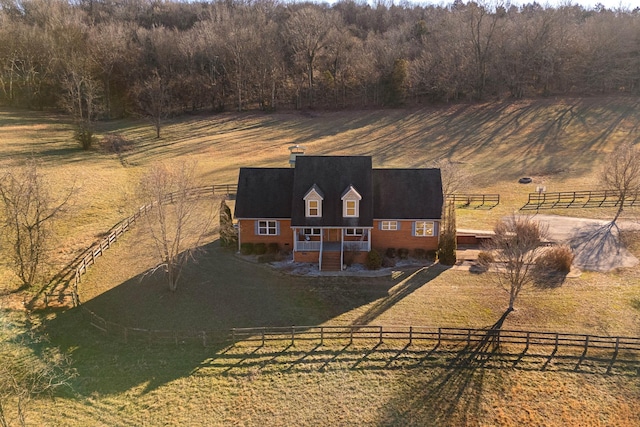 birds eye view of property featuring a rural view