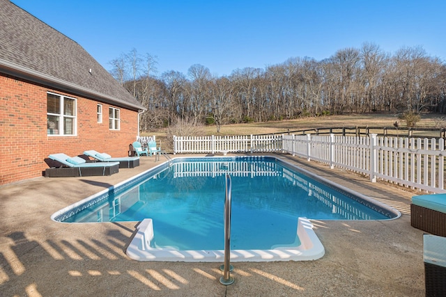 view of swimming pool featuring a patio