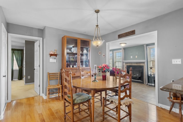 dining space with light hardwood / wood-style floors