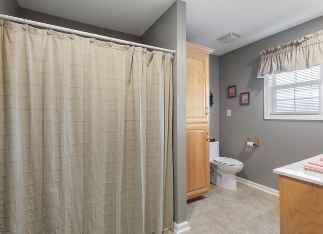 bathroom with vanity, toilet, and walk in shower