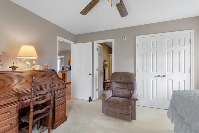 carpeted home office with ceiling fan