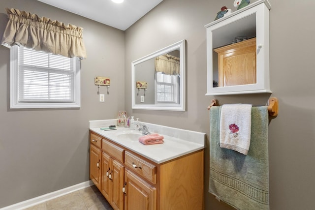 bathroom with tile patterned flooring and vanity