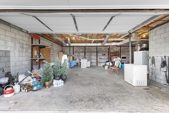 garage featuring washer / clothes dryer and fridge