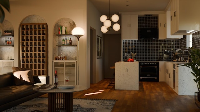 interior space featuring sink, dark hardwood / wood-style floors, and a notable chandelier