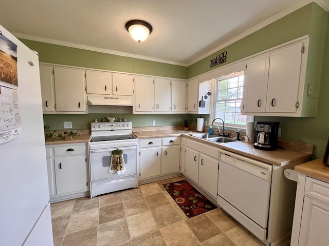 kitchen with white appliances, white cabinetry, and sink