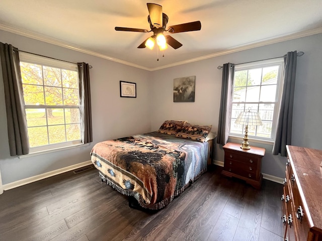 bedroom with ceiling fan, dark hardwood / wood-style flooring, and ornamental molding