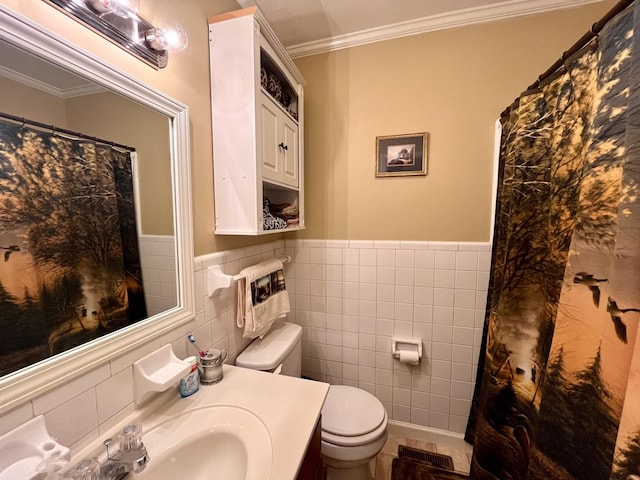 bathroom featuring crown molding, toilet, tile walls, and vanity