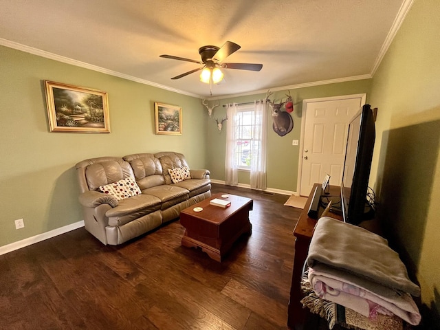 living room featuring ceiling fan, ornamental molding, and dark wood-type flooring