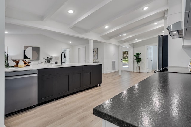 kitchen with vaulted ceiling with beams, sink, stainless steel dishwasher, and light hardwood / wood-style floors