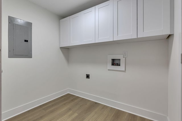 laundry area featuring washer hookup, cabinets, hookup for an electric dryer, electric panel, and light hardwood / wood-style floors