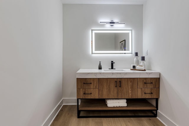 bathroom with vanity and wood-type flooring