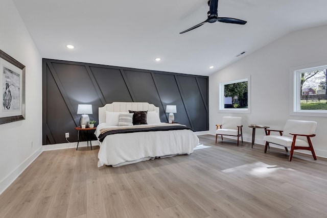 bedroom featuring light wood-type flooring, ceiling fan, and lofted ceiling