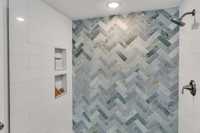 bathroom with a tile shower