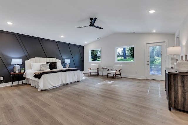 bedroom featuring access to outside, ceiling fan, light hardwood / wood-style flooring, and vaulted ceiling