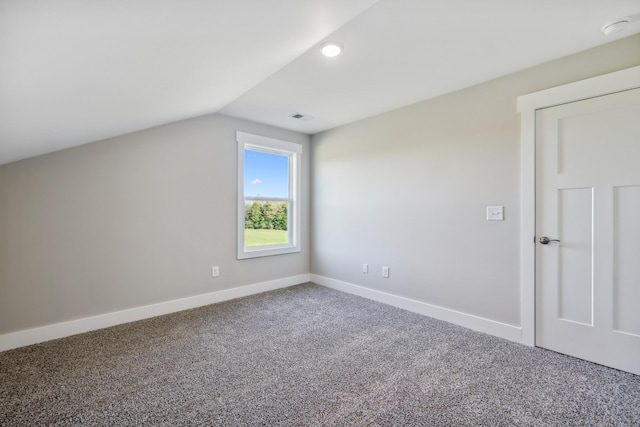 bonus room with carpet and vaulted ceiling