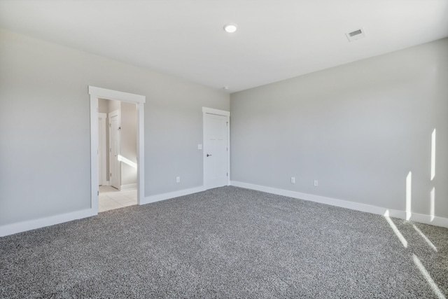 unfurnished bedroom with light colored carpet