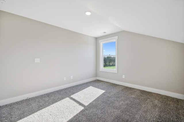 additional living space featuring carpet floors and lofted ceiling