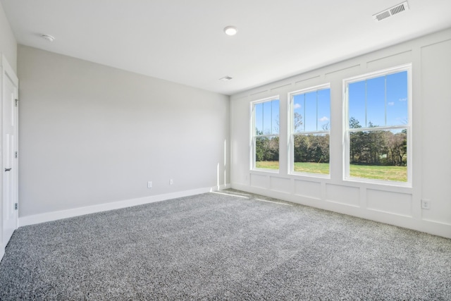 spare room featuring carpet floors