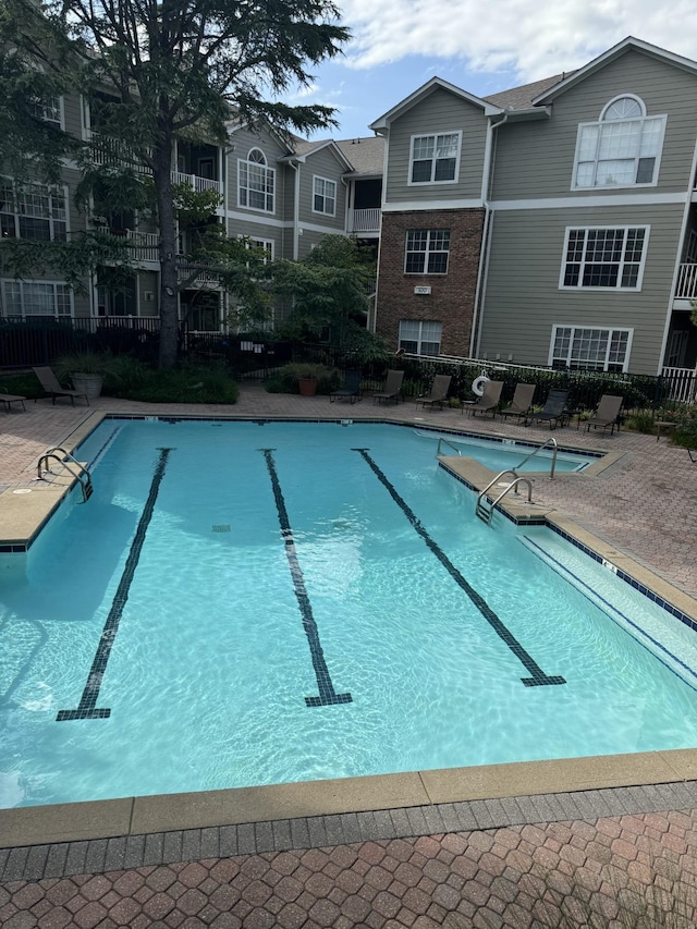 view of pool featuring a patio area