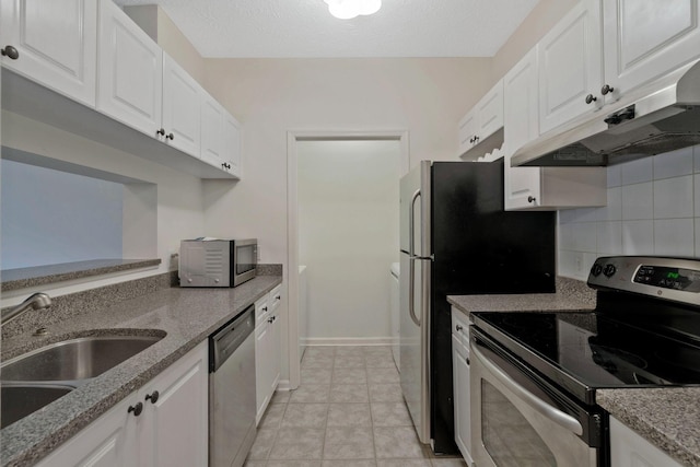 kitchen with white cabinets, sink, appliances with stainless steel finishes, and tasteful backsplash