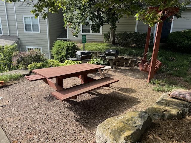 view of home's community with a patio area