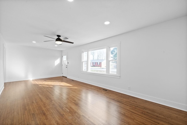 spare room with ceiling fan and hardwood / wood-style floors