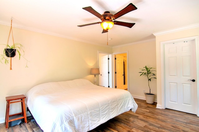 bedroom featuring crown molding, dark wood-type flooring, and ceiling fan