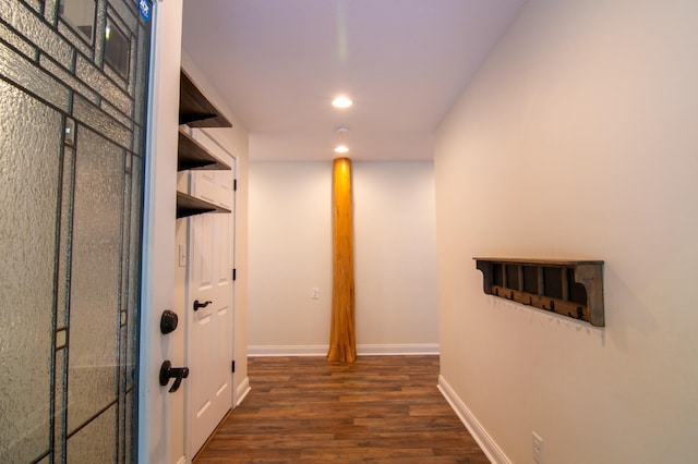 corridor featuring dark wood-type flooring