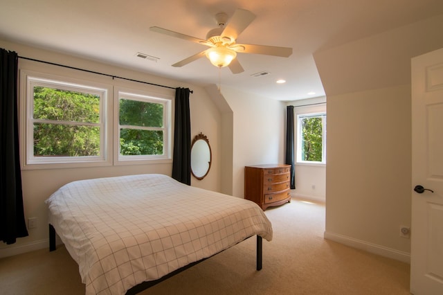 bedroom featuring light carpet and ceiling fan