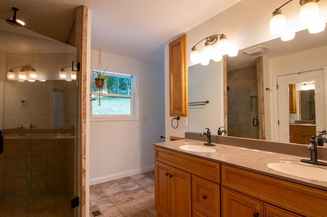 bathroom with vanity and an enclosed shower