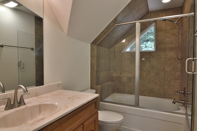 full bathroom with vanity, lofted ceiling, toilet, and bath / shower combo with glass door