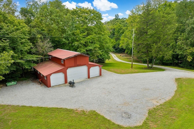 surrounding community with an outbuilding and a lawn